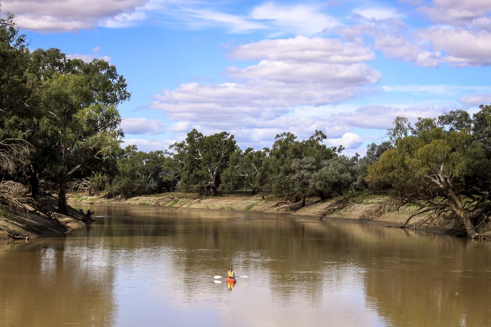 Kayaker approaching bank, Darling River, near Louth, NSW